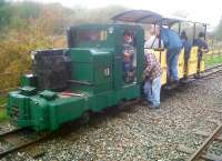 <I>Is there room for a little one?</I> The BLS all line tour of the Apedale Valley Light Railway only had room for 17 passengers and a brakeman. The engine is a 4-wheeled Simplex diesel with transverse radiator. The AVLR is located in the 454 acre Apedale Country Park near Newcastle-under-Lyme, once an opencast mining area.<br><br>[Ken Strachan 30/10/2011]