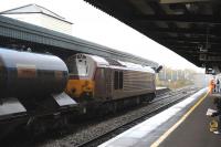 67008 stands at Didcot station on a wet 3 November 2011 with a Network Rail RHTT (which included 67027 at the other end). The train was operating  around the station area, the Didcot triangle and other associated lines.<br><br>[Peter Todd 03/11/2011]