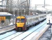 View west from the footbridge at Bathgate station on 14 December 2010 as the 13.47 to Helensburgh Central pulls away from platform 2.<br><br>[John Furnevel 14/12/2010]