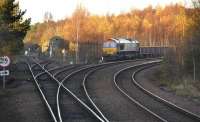 66141 stands in the down loop at Ladybank Junction with an engineer's train on 6 November 2011.  To the left is the line through Newburgh to Hilton Junction with the remains of the old wagon shops in the background.<br><br>[Bill Roberton 06/11/2011]