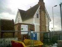 The old station at Ridgmont, just a stone's throw from the M1, seen here in October 2011 being restored and upgraded. The sign beyond the skip says there will be a heritage railway centre - a small one, I suspect. At least the station isn't pink [see image 30783].<br><br>[Ken Strachan 21/10/2011]