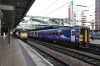 Scene at Leeds on 4 November 2011 with a class 91 waiting to return to Kings Cross, while class 144 and 153 diesel services share the adjacent platform.<br><br>[John McIntyre 04/11/2011]