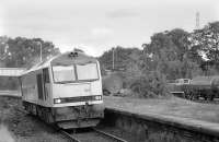 60021 passes through the platforms at Cameron Bridge, returning from an Open Day at Methil Power Station on 28 September 1991. On the right the resident 0-6-0 diesel shunter fusses around with CO2 tankers.<br><br>[Bill Roberton 28/09/1991]