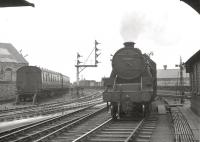 Black 5 no 45457 off Ardrossan shed, photographed from the foot of Ardrossan Harbour Junction signal box on 29 December 1962 [see image 8170]. Winton Pier is approximately 100 yards behind the camera and the line off to the left leads to Ardrossan North.<br><br>[R Sillitto/A Renfrew Collection (Courtesy Bruce McCartney) 29/12/1962]