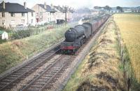 Haymarket V2 no 60816 runs past Broomhouse shortly after turning north at Saughton Junction in the summer of 1959 with a stopping train heading for the Forth Bridge.<br><br>[A Snapper (Courtesy Bruce McCartney) 25/07/1959]