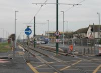 A simple elegance might be the description applied to the new tramstops in Blackpool and Fleetwood. This is Stanley Road, on the south side of Fleetwood, constructed during 2011. In that same year the old Fleetwood Fire Station has been demolished and work started on a new building. [See image 32601] for the same location 11 months earlier.<br><br>[Mark Bartlett 09/11/2011]