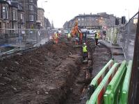 Utility services excavation works taking place alongside Haymarket station (off picture to the right) in preparation for the section of track to be laid directly ahead along West Maitland Street / Shandwick Place to link up with the tracks on Princes Street.<br><br>[David Pesterfield 08/11/2011]
