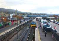 Autumn in Wharfedale. Looking towards the buffers at Ilkley on 4 November 2011 with a Class 333 recently arrived from Leeds. The station once had through lines to Skipton and, over on the right, the remains of the two through platforms are now used as a car park. [See image 12939]<br><br>[John McIntyre 04/11/2011]