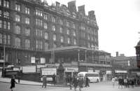View of St Enoch station in the spring of 1963. The predominant advertisement on this occasion concerns the Grand National at Aintree, with a return excursion fare available at £4. [Editor's note: Reasonable as that might sound, anyone thinking of buying a ticket would have been better off putting the money on <I>Ayala</I>, the outsider who romped home in that year's race at a starting price of 66-1.]    <br><br>[R Sillitto/A Renfrew Collection (Courtesy Bruce McCartney) 30/03/1963]
