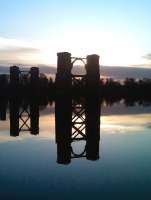 The surviving piers of Alloa swing bridge are reflected in the still waters of the Forth on an autumn afternoon. View south across the river towards Throsk on 12 November.<br><br>[Grant Robertson 12/11/2011]