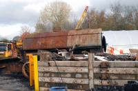 A scrapyard!!! The rusting hulk is Hunslet 50550 Class 0-6-0ST, 2411 of 1941, precursor to the J94's. For all its poor looks the locomotive is in good condition, the chassis and boiler are in good order with all fittings present. It just needs a touch of paint!<br><br>[Peter Todd 12/11/2011]