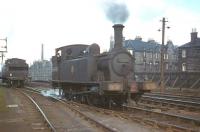 With an N15 'big Gorgie pilot' evidently in hot pursuit, 'wee Gorgie pilot' J88 No. 68335 draws into Gorgie East yard on 3rd April 1961. View is north with the bridge over Gorgie Road between the locomotives.<br><br>[Frank Spaven Collection (Courtesy David Spaven) 03/04/1961]