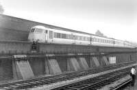 One of the BR Met-Cam 'Blue Pullman' sets comes off the flyover into Old Oak depot, running west alongside the retaining wall of the Grand Union Canal. These relatively short-lived units (1960-1973) ended their days on the <I>Bristol Pullman</I> [see image 4554] and, while not a great success in themselves, did help to pave the way for the development of the IC125 HSTs. Photographed from a passing DMU heading east towards Paddington in 1972, the year before the last units were withdrawn. [With thanks to David Spaven, Vic Smith, Ian McIvor and Crinan Dunbar]<br><br>[Bill Roberton //1972]