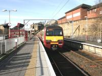 Scene at Springburn station in 2005 with a train for Dalmuir awaiting its departure time in bay platform 3.<br><br>[John Furnevel 14/02/2005]