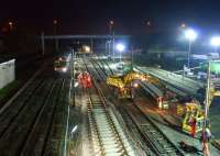 Engineering possession on the fast lines at Farington Junction on 13 November 2011 as a southbound Class 185 to Manchester Airport passes on the up slow. For a similar daylight view from 2007 [see image 16522].<br><br>[John McIntyre 13/11/2011]