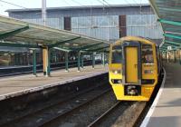 At Platform 6, now designated as <I>The Settle and Carlisle Line</I> platform, 158850, with 158816, waits for departure time with the 1404 hrs service to Leeds on 16 November 2011. The impressive trainshed dominates the background           <br><br>[Mark Bartlett 16/11/2011]