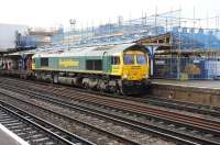Freightliner 66570 takes a northbound freight through Eastleigh station on 17 November 2011. <br><br>[Peter Todd 17/11/2011]