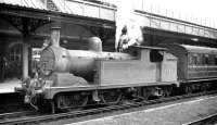 Push-pull fitted G5 0-4-4-T no 67261 of Blyth North (52F) stands at Monkseaton station around 1958 with a train off the Blyth and Tyne 'Avenue' branch. Monkseaton provided a connection for trains from Blyth with the electric services into Newcastle. The G5 was withdrawn at the end of 1958 with the B&T line north closing in 1964. Nowadays Monkseaton is served by trains on the Tyne & Wear Metro [see image 4461].<br><br>[K A Gray //1958]