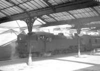 BR Standard Class 4 2-6-4T no 80049 stands in the bay following arrival with a train at Ardrossan Town in March 1963.<br><br>[R Sillitto/A Renfrew Collection (Courtesy Bruce McCartney) 09/03/1963]