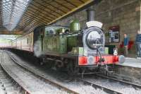 Veteran J72 0-6-0T no 69023 stands with a train under the overall roof at Pickering station on 30 June 2011. <br><br>[John Furnevel 30/06/2011]