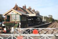 Neat permanent - way, no weeds, no litter, lots of flower baskets - this is Attleborough, Norfolk, on 27 September 2009, a picture book country station. The operation of the gates was entirely manual, the signalman nipping out from his box to unlock and push them across road!<br><br>[Brian Taylor 27/09/2009]