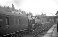 Standard Class 4 2-6-4T no 80063 about to take a train out of Callander on 12 April 1963 bound for Stirling. Standing on the trackbed below the bridge in the light jacket preparing to take his shot [see image 6538] is John Robin.<br><br>[R Sillitto/A Renfrew Collection (Courtesy Bruce McCartney) 12/04/1963]