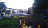 Looking through the fence at the Daigeo plant at Menstrie on 12 November 2011. The rails now end in the foreground, although a stranded set of buffer stops remains in the middle distance [see image 8393]. <br><br>[Grant Robertson 12/11/2011]