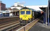 Freightliner 66593 passes through Eastleigh station on 17 November with containers bound for Southampton.<br><br>[Peter Todd 17/11/2011]