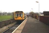 142015 waits at Colne in the 1990s preparing to set off for Blackpool South. The unit had recently been reallocated to the area from the south-west and at the time still retained the livery of the previous sector operators.<br><br>[John McIntyre //]