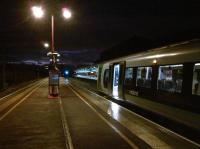 The 07.02 London Midland service from Rugby to Euston via Northampton waits for passengers on the morning of 18 November as dawn breaks ahead.<br><br>[Ken Strachan 18/11/2011]