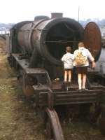 Exploring the internal mysteries of a WD 2-8-0 on Bo'ness scrap line in April 1963. [Railscot note: The locomotive in question is 90436, withdrawn from Dawsholm in June 1962 and cut up at Darlington Works in November 1963.] <br><br>[Frank Spaven Collection (Courtesy David Spaven) /04/1963]