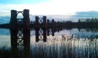 View south across the Forth towards Throsk at dusk on 12 November 2011 with the piers of the old swing bridge reflected in the still waters.<br><br>[Grant Robertson 12/11/2011]