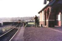 Platform view at Sea Mills on the Severn Beach branch in 1974 with an approaching DMU for Temple Meads crossing the bridge over the River Trym [see image 22225].<br><br>[Ian Dinmore //1974]