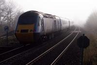 The up <I>Highland Chieftain</I> disappears into sunlit mist at Bridge of Allan on November 6th 2011. At the time, there was some doubt as to whether this long distance service could survive the eventual withdrawal of the HST stock and a 'Save the Chieftan' campaign had already started.<br><br>[Mark Dufton 06/11/2011]