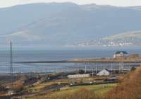 Looking west between Dumbarton and Cardross over the Tail of the Bank and the Argyll Hills in November 2011 as a Class 334 is dwarfed by its surroundings as it heads towards Helensburgh.<br><br>[John McIntyre 22/11/2011]