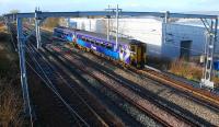 An eastbound Sprinter approaches Hillington West. The new third line is to its left.<br><br>[Ewan Crawford 27/11/2011]