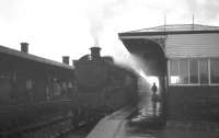 A wet and misty Saturday morning on the Ayrshire coast in May 1963 sees Fairburn 2-6-4T no 42190 bring an Ardrossan (Winton Pier) - Kilmarnock train into the platform at Irvine. [Note the Station Master!]  <br><br>[R Sillitto/A Renfrew Collection (Courtesy Bruce McCartney) 25/05/1963]
