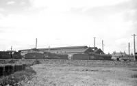 The yard and shed at Ardrossan, seen in November 1962. The lineup (left to right) includes 67D based locomotives 42191, 40625 and 40668. The latter pair were 'stored' at that stage, having been officially withdrawn in October the previous year. The Stanier 2-6-4T was officially withdrawn the following month. Ardrossan shed closed completely in February 1965. [See image 28561]<br><br>[R Sillitto/A Renfrew Collection (Courtesy Bruce McCartney) /11/1962]