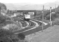 A Carlisle - Barrow DMU approaching Millom on the Cumbrian coast in 1983.<br><br>[John Furnevel 03/10/1983]
