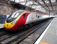 Virgin Pendolino 390044 awaits departure to Euston from Glasgow Central platform 2 on 30 November 2011.<br><br>[John Steven 30/11/2011]