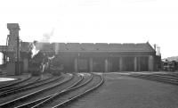 A full frontal of 64B Haymarket in the summer of 1962 with a mixture of steam and diesel on shed. Most of the locomotives are under cover, with a pair of B1s (61078 and 61176) standing in the yard [see image 36410] and an unidentified Deltic receiving attention over on the right.<br><br>[R Sillitto/A Renfrew Collection (Courtesy Bruce McCartney) /07/1962]