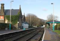 There are only six trains a day on the Blaenau Ffestiniog branch in the 2011 timetable. One Sprinter suffices for services and this is the only surviving passing loop at what was the original Llanrwst station. It was renamed North Llanrwst when a new halt opened in the centre of the town in 1989. View north towards Llandudno Junction with the signal box visible at the far end of the loop.<br><br>[Mark Bartlett 01/12/2011]