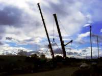 Two cranes, having taken up position, start lowering new reinforced concrete beams into place over London Road, Glasgow, on 14 May 2011.    <br><br>[Colin Harkins 14/05/2011]