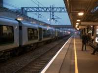 Patience is a virtue - a 12-car assembly of 350's forming a commuter service to London Euston awaits the off at Milton Keynes Central.<br><br>[Ken Strachan 11/11/2011]