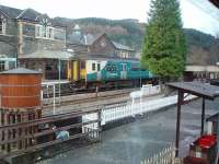 A Blaenau Ffestiniog service calls at Betws-y-Coed, as seen through the window of the MkI coach that has served as a cafe at the railway museum for many years. [See image 30607]. Note in the corner of this picture <I>Toby the Tram Engine</I>, who can be driven by young children on his own miniature line - and don't they love it!<br><br>[Mark Bartlett 01/12/2011]