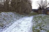 Looking west along the Blairenbathie Colliery branch trackbed from the the site of the level crossing over Main Street, Kelty, in December 2011. The branch closed in 1964.<br><br>[Bill Roberton 04/12/2011]