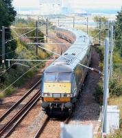 Just over 30 miles out of Edinburgh on a summer's afternoon in 2007 a GNER Waverley - Kings Cross service speeds through the sweeping curve at Cockburnspath.<br><br>[John Furnevel 30/06/2007]