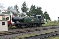 GWR 0-6-2T no 5637 takes on water in between operating 'Santa Specials' on the East Somerset Railway on 10 December.<br><br>[Peter Todd 10/12/2011]