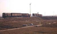 Amid the moonscape of the new BR Millerhill marshalling yard, a mixed 'cut' of parcels and goods wagons rolls over the up hump on 23rd February 1963. At this time the yard had been officially open for approximately eight months.<br><br>[Frank Spaven Collection (Courtesy David Spaven) 23/02/1963]