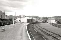 General view of Ballater station on the Royal Deeside line in July 1962. The line closed in 1966 and the refurbished station building has since become a visitor centre and museum. The next train for Aberdeen stands at the platform.<br><br>[R Sillitto/A Renfrew Collection (Courtesy Bruce McCartney) 07/07/1962]
